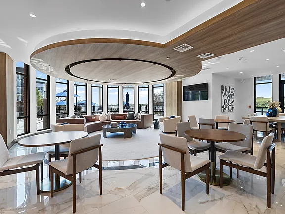 The Breton, multifamily by HH Designers in Bayonne, NJ, club lounge with terrace views