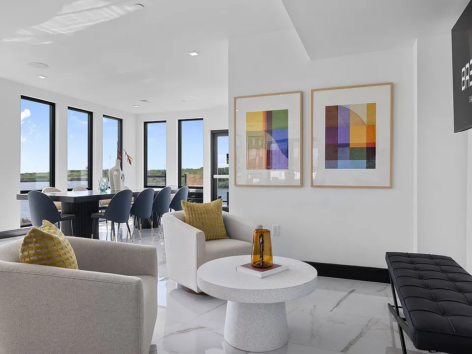 The Breton, multifamily by HH Designers in Bayonne, NJ, co-working lounge with water views