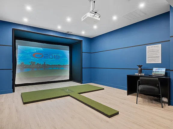 The Breton, multifamily by HH Designers in Bayonne, NJ, golf simulator room