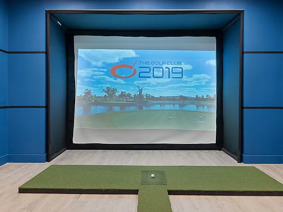 The Breton, multifamily by HH Designers in Bayonne, NJ, golf simulator