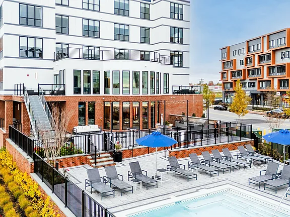 The Breton, multifamily by HH Designers in Bayonne, NJ, pool deck and building