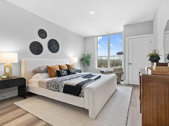 The Breton, multifamily by HH Designers in Bayonne, NJ, bedroom with water view