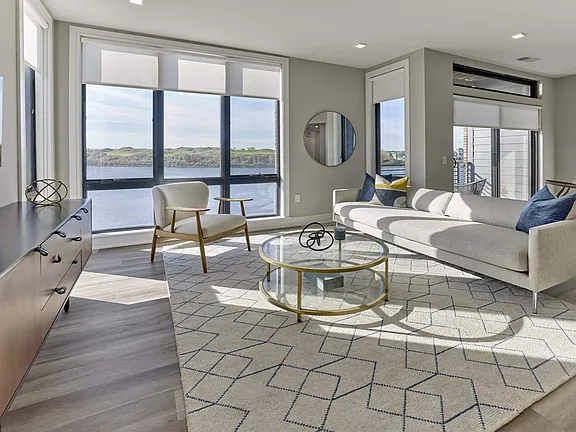 The Breton, multifamily by HH Designers in Bayonne, NJ, living room with water views